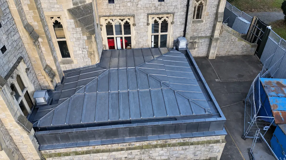 Aerial view of a lead roll roof on a gothic stone building